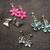 Selling 4 pairs of earrings, butterfly, flowers w/ gift bag 1 thumbnail