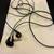 Black in-ear headphones 1 thumbnail