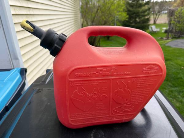 Two Gas Cans - one is Briggs and Stratton Smart Fill 1