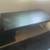 Solid Black wood coffee table with silver chrome legs 1 thumbnail