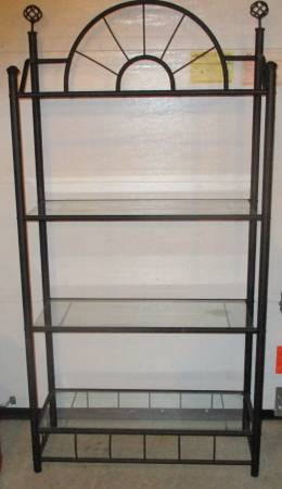 Metal and glass display with 4 shelves it's a solid unit. 1