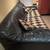 black leather and gold/black diamond-pattern fabric sofa 2 thumbnail