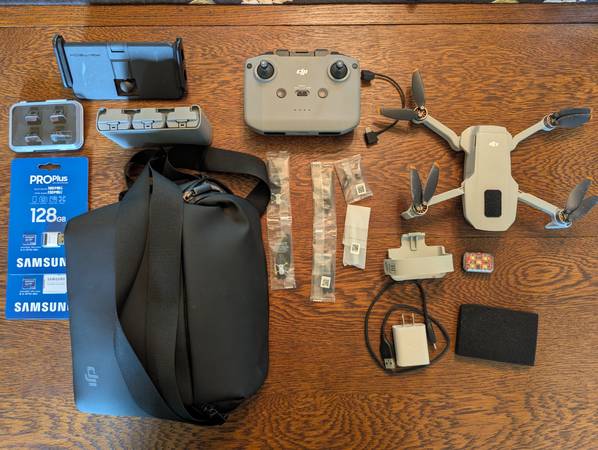 Dji mini 2 fly more + extras, less than 20 hours of flight time. 1