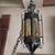 Caged glass midievil wrought iron swag light amber 1 thumbnail