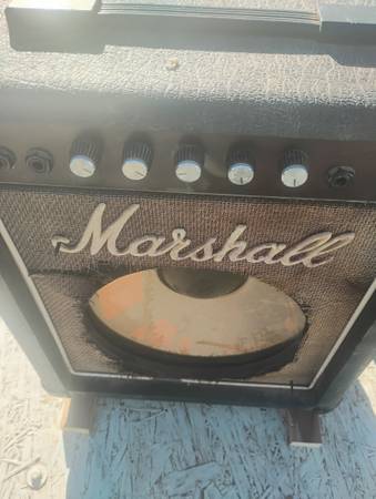 A Marshall that works good but needs tweed replaced... seen better days 1