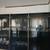 vintage 1980s postmodern black lacquer and brass china cabinet / displ 1 thumbnail