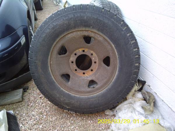 8 lug Ford wheel with LT265/70R17 tire, old, good for spare 1