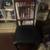 Antique chair/wooden with black seat 1 thumbnail