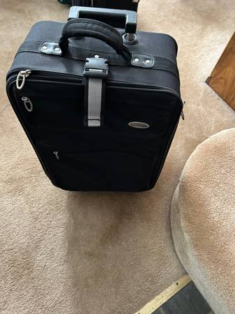 Nice Black Carry-On Upright Luggage on Wheels with Pull Handle 1