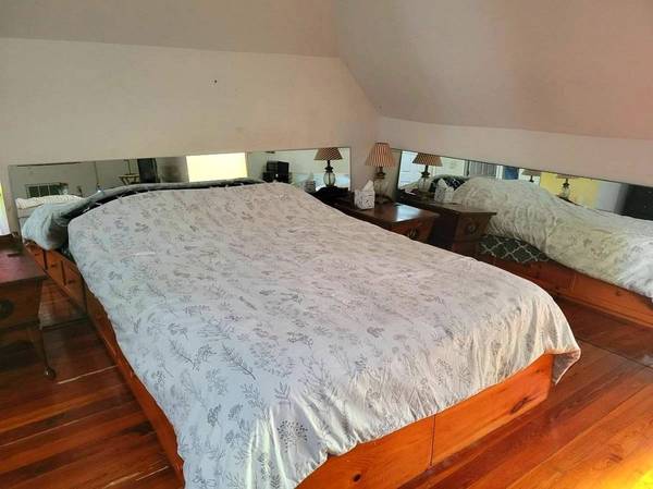 Clean Room Offering a Comfortable Spacious Master Bedroom 1