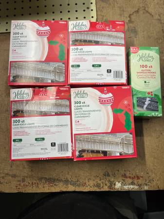 4 new in box 300 count clear icicle lights made by holiday living and 1