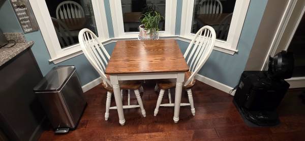 Solid oak table and two chairs 1