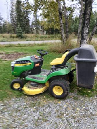 John Deere e100 with twin bagger 1