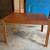 Oak dining room table with leaf for sale. 1 thumbnail
