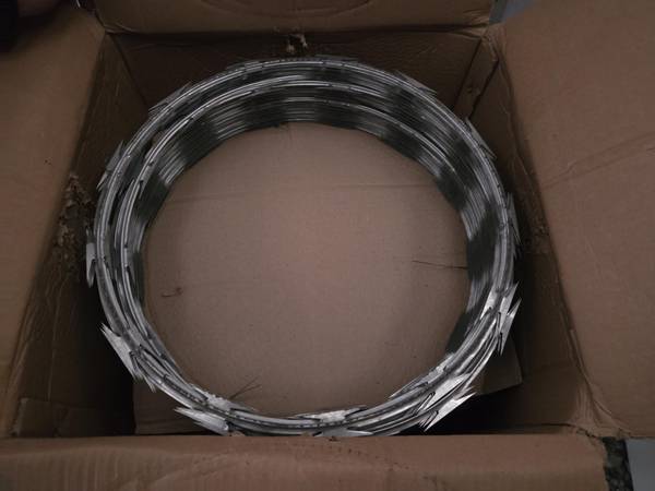 8 rolls (392 ft) concertina wire in original boxes 1