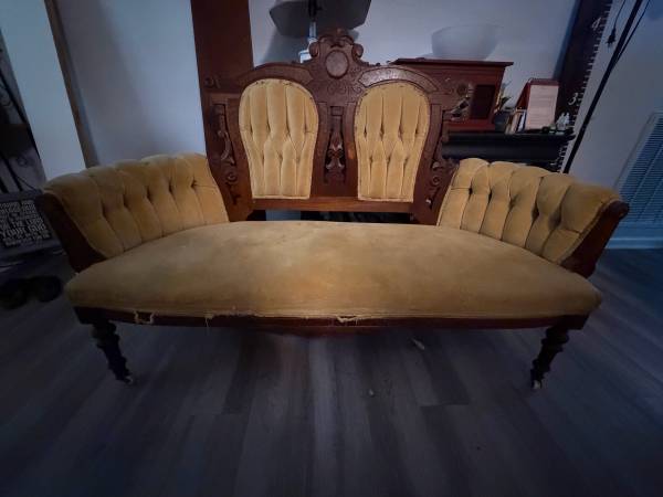 Antique Victorian-style carved settee 1