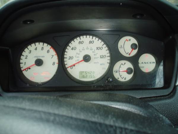02-03 Mitsubishi Lancer OZ Speedometer, Radio, Coils 1