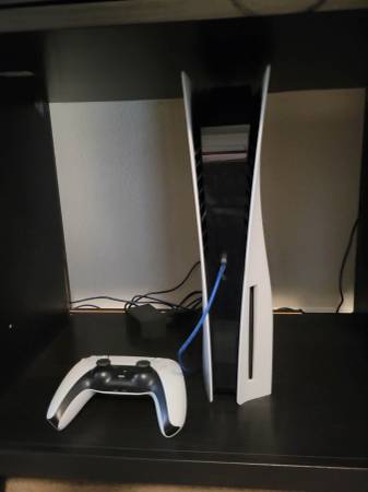 PS5 with controller 1