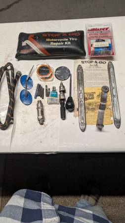 Motorcycle flat tire kit also 2005 priory light and side covers. 1