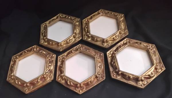 5 small plastic gold antiqued hexagonal frames. 1