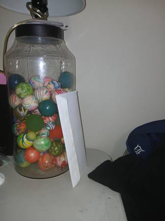 Old bouncy balls in old large glass jar 1