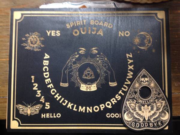Wooden Ouija board with planchette 1