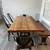 Solid Wood Reclaimed Dining Table with Cast Iron Base – Includes  2 Metal Chai 1 thumbnail