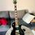 Epiphone Les Paul guitar black and gold 1 thumbnail