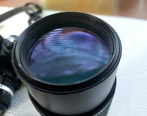 Nikon EM film camera, 50mm f1.8, 75-150mm f3.5, flash