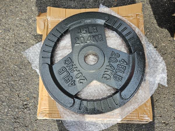 Pairs of 45 lb Olympic weight plates New 1
