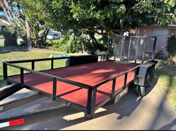 Dual axle utility trailer with rear ramp gate 1