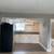 Studio 1/BA, Modern Kitchen with Tile Backsplash, Laundry Center 1 thumbnail