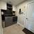 This ranch modern farmhouse features Hardie plank siding with board an 13 thumbnail