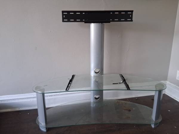 TV stand with adjustable amount comes with brackets and everything too Mount you 1