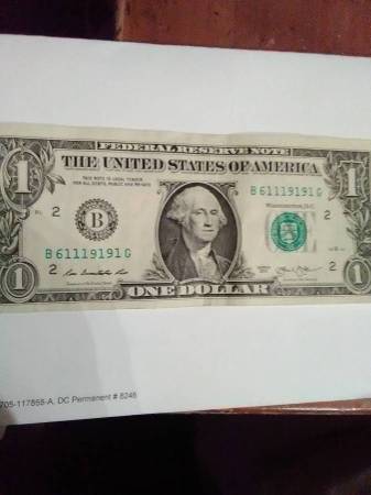 COOL $1, WITH FIVE 1s, IN THE TRINARY SERIAL#61119191,ALSO MIS-ALIGNED 1