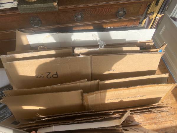 Flattened moving boxes, wrapping paper, bubble wrap 1