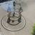 Circular Glass Table on a Bronze Base 6 thumbnail