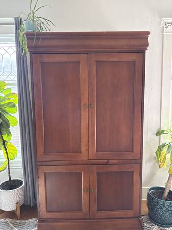 65 inch tv.  Large cherry cabinet 1