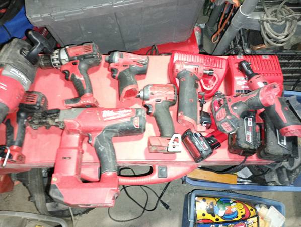 14 Milwaukee tools 4 batteries and 2 chargers 1