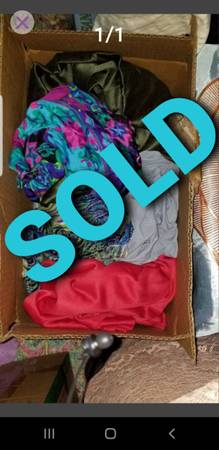Box of assorted colored fabrics. 1