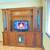 Television console, real wood w/ bookmatch woodgrain, glass shelves 1 thumbnail