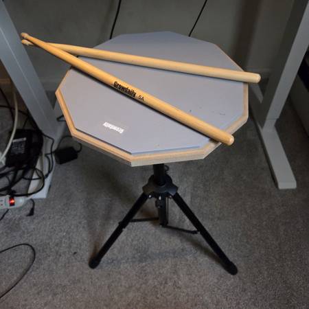 Practice drum pad with sticks 1