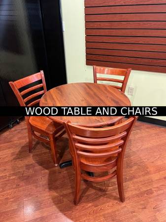 WOODEN ROUND TABLE AND THREE MATCHING CHAIRS 1