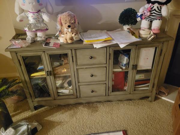 Large storage cabinet with 4 glass doors and 3 drawers. 1