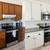 Kitchen cabinet painting and refinishing service. 1 thumbnail