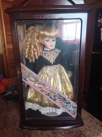 Vintage porcelain doll in a shadow box 1