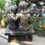 An enchanting siblings reading on bench garden statue 4 thumbnail