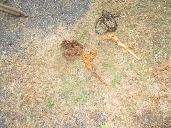 two chains and load binders for hauling landscape truck trailer 1