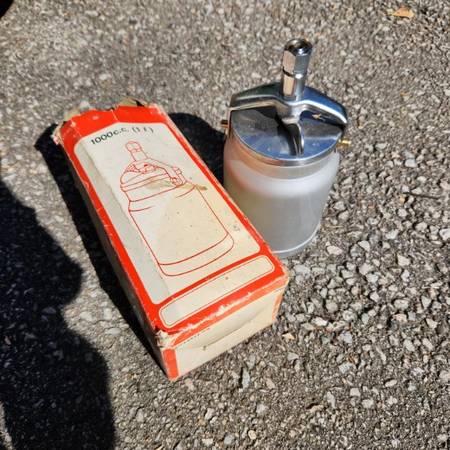 Pneumatic spray paint can. 1