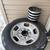 A set of 4 stock 2012 eight lug Chevy rim and tire 255/65R17 1 thumbnail